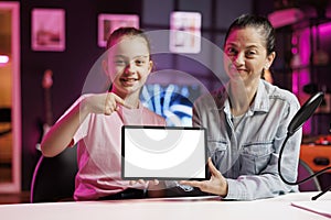 Daughter and mother being sponsored by partnering brand to do mockup laptop unboxing content