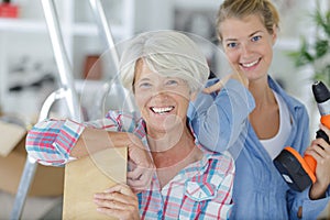 daughter and mother doing diy photo