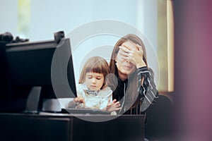 Daughter Ruining the Work of Her Mom Sitting at her Desk