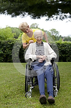 Daughter Showing Concern for Senior Dad in Wheel C