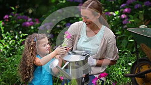 Daughter showing a flower to her mother