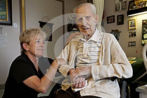 Daughter visiting Dad at Long Term Care Facility