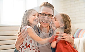 Daughters congratulating dad