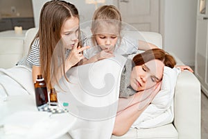Daughters do not interfere with sick mom sleep. photo
