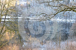 GemÃÂ¼ndener Maar in winter, mystic athmosphere with reflections on the calm water photo
