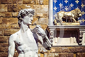 David`s Statue by Michelangelo and Palazzo Vecchio, Florence, Italy