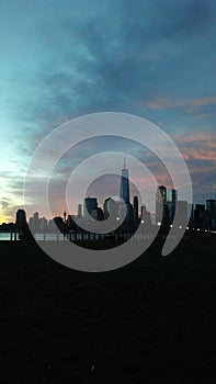 Dawn above Manhattan, New York, NY Seen across Hudson River from Liberty State Park in Jersey City, NJ. photo