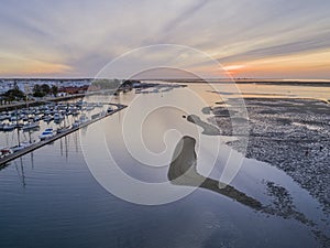 Dawn aerial seascape view of Olhao Marina, waterfront to Ria Formosa natural park.