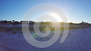 Dawn aerial view of South Australian beach with sun rising over Adelaide