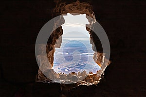 Dawn  through a breach in the wall at the Massada Ruins, a fortress built by Herod the Great on a cliff-top off the coast of the