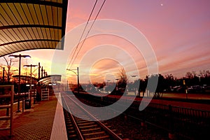 Dawn breaking upon a commuter train station