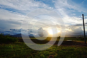 Dawn breaking over farming land countryside