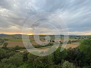 Dawn cloudscape landscape on a brown field landscape in Girona, Catalonia