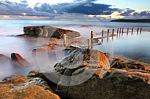 Dawn coastline and Mahon Rock Pool photo