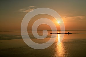 Dawn early in morning over wide long Volga river