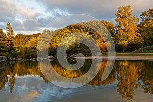 Dawn on the fall colors with relections on the pond