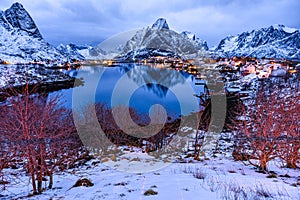 Dawn in icy lake and mountains of Norway, Reine