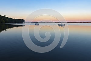 Dawn illuminates lake champlain in saint albans bay vermont