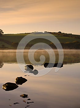 Dawn on a Misty Lake
