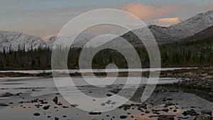 Dawn in the mountains. Beautiful mountain landscape. Reflection in a clear lake.