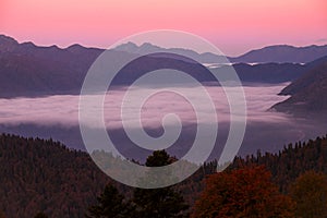 Dawn in the mountains and fog in the valley.