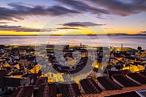 The Dawn of a New Day: A Breathtaking Sunrise View from Mirador de Santa Lucia in Lisbon