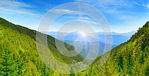 Dawn in the picturesque mountains covered with forests.