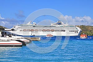 Dawn Princess, cruise ship of Princes Cruises line anchored at sea by Bora Bora island