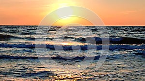 Dawn on sea. Sunset on sea. Sunrise, sunset on ocean. Glowing sun above horizon