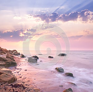 Dawn sunrise landscape over beautiful rocky coastline in the Sea
