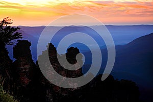 Dawn sunrise silhouettes the Three Sisters Blue Mountains Australia