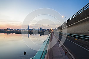 Dawn View of Taipei city from Tamsui River photo