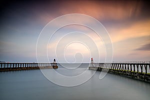 Dawn, Whitby Harbour piers, Yorkshire UK photo