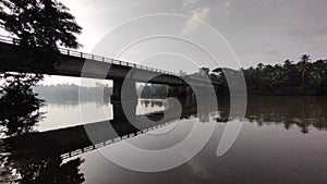 Dawns Embrace: A Morning Stroll on the River Bridge