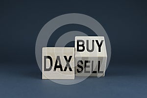 Dax buy or sell. The cubes form the words Dax buy or sell photo