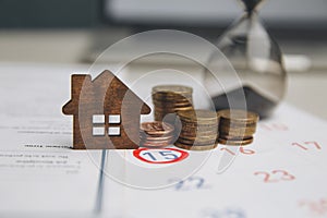 Day of buying or selling a house. Day of payment for rent or loan. Calendar and house. It`s time to insure your house