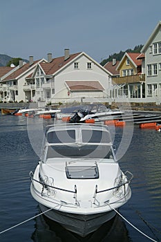 Day-cruiser and water-front houses