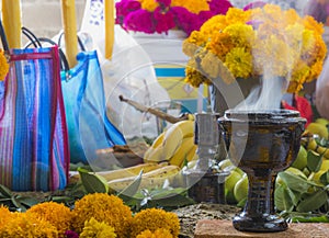 day of the dead, colorful mexican altar and ceramic cup for copal and incense for offerings