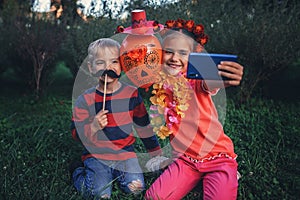 Day of the Dead and Halloween. Cute kids wearing in themed costumes for fun party