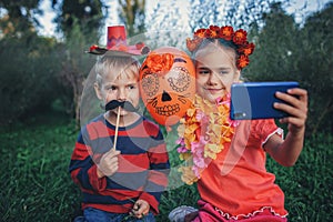 Day of the Dead and Halloween. Cute kids wearing in themed costumes for fun party