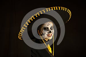 Day of the dead, latin party, child disguised as a skull