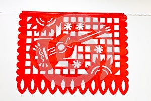 Day of the Dead, Papel Picado with a guitar red traditional Mexican paper cutting flag. photo