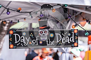 Day of the dead sign with sugar skull, at the Dia de Los Muertos celebrations