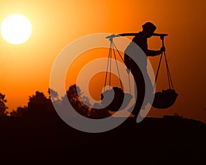 Day Labour Holding the Goods Carrier with Both Hands Background Photograph