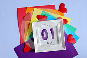 day of the month 01 July calendar . Calendar date in a white frame on a rainbow background