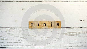 Day of the Ninja.words from wooden cubes with letters photo