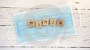 Day of the Ninja.words from wooden cubes with letters photo