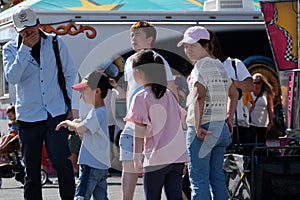 attractions families mothers with children strollers tourists backpacks beautiful sunny day hats Cloverdale rodeo