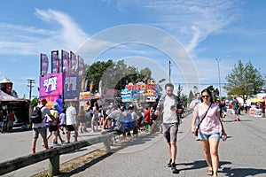 attractions families mothers with children strollers tourists backpacks beautiful sunny day hats Cloverdale rodeo
