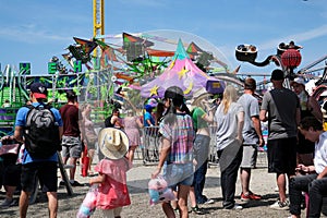 attractions families mothers with children strollers tourists backpacks beautiful sunny day hats Cloverdale rodeo